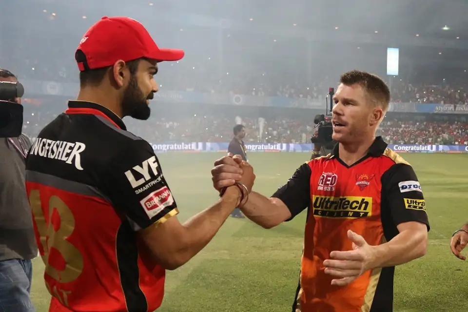 🏏 IPL Winners from 2008 till now – A Season-by-Season Breakdown 20 Virat Kohli and David Warner greet each other after the match